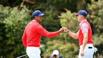 MELBOURNE, AUSTRALIA - DECEMBER 12: Playing Captain Tiger Woods of the United States team and Justin Thomas of the United States team celebrate on the 14th green during Thursday four-ball matches on day one of the 2019 Presidents Cup at Royal Melbourne Golf Course on December 12, 2019 in Melbourne, Australia. (Photo by Quinn Rooney/Getty Images)