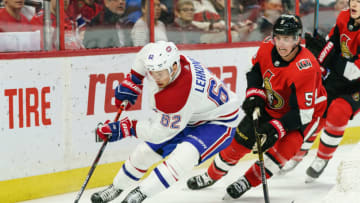 OTTAWA, ON - FEBRUARY 22: Artturi Lehkonen #62 of the Montreal Canadiens uses his body to protect the puck from Mike Reilly #5 of the Ottawa Senators at Canadian Tire Centre on February 22, 2020 in Ottawa, Ontario, Canada. (Photo by Jana Chytilova/Freestyle Photography/Getty Images)