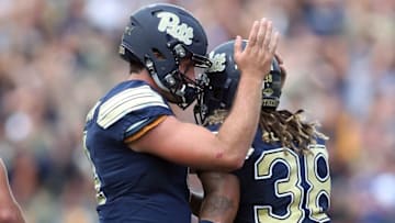 Sep 10, 2016; Pittsburgh, PA, USA; Pittsburgh Panthers quarterback Nathan Peterman (L) congratulates defensive back Ryan Lewis (38) after Lewis had an interception in the end zone to secure the win against the Penn State Nittany Lions during the fourth quarter at Heinz Field. PITT won 42-39. Mandatory Credit: Charles LeClaire-USA TODAY Sports