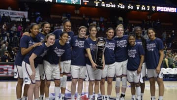 UNCASVILLE, CT - MARCH 06: UConn Huskies hold the American Athletic Conference Champions trophy after the game as the South Florida Bulls take on the UConn Huskies on March 06, 2018 at the Mohegan Sun Arena in Uncasville, Connecticut. (Photo by Williams Paul/Icon Sportswire via Getty Images)