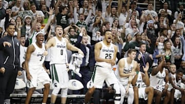 Dec 6, 2016; East Lansing, MI, USA; Michigan State Spartans guard Cassius Winston (5) guard Kyle Ahrens (0) forward Kenny Goins (25) and the rest of the Spartan bench celebrate after a basket during the second half against the Youngstown State Penguins at Jack Breslin Student Events Center. Spartans win 77-57. Mandatory Credit: Raj Mehta-USA TODAY Sports