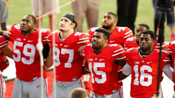 Sep 26, 2015; Columbus, OH, USA; Ohio State Buckeyes players (from left) Tyquan Lewis (59), Joey Bosa (97), Ezekiel Elliott (15) and quarterback J.T. Barrett (16) following the game versus Western Michigan Broncos at Ohio Stadium. Ohio State won the game 38-12. Mandatory Credit: Joe Maiorana-USA TODAY Sports