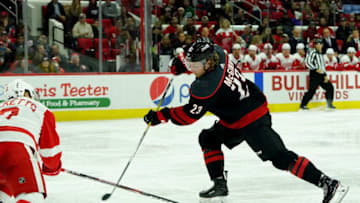 RALEIGH, NC - NOVEMBER 1: Brock McGinn #23 of the Carolina Hurricanes shoots and scores a short-handed goal during an NHL game against the Detroit Red Wings on November 1, 2019 at PNC Arena in Raleigh, North Carolina. (Photo by Gregg Forwerck/NHLI via Getty Images)