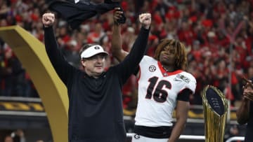 Georgia Bulldogs head coach Kirby Smart celebrates with defensive back Lewis Cine (16) Mandatory Credit: Trevor Ruszkowski-USA TODAY Sports