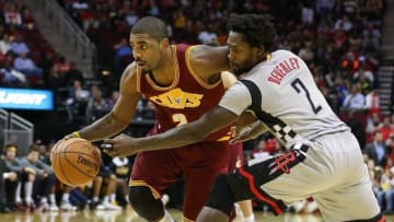 Jan 15, 2016; Houston, TX, USA; Cleveland Cavaliers guard Kyrie Irving (2) dribbles the ball as Houston Rockets guard Patrick Beverley (2) defends during the game at Toyota Center. Mandatory Credit: Troy Taormina-USA TODAY Sports