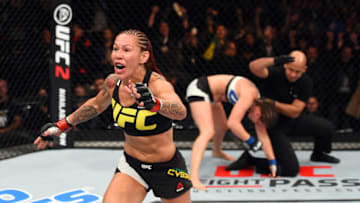 CURITIBA, BRAZIL - MAY 14: (L-R) Cristiane 'Cyborg' Justino of Brazil celebrates after defeating Leslie Smith in their women's catchweight bout during the UFC 198 event at Arena da Baixada stadium on May 14, 2016 in Curitiba, Parana, Brazil. (Photo by Josh Hedges/Zuffa LLC/Zuffa LLC via Getty Images)