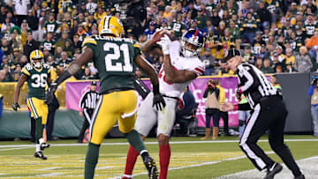 GREEN BAY, WI - OCTOBER 09: Odell Beckham Jr. #13 of the New York Giants catches a pass for a touchdown in front of Ha Ha Clinton-Dix #21 of the Green Bay Packers during the second half of a game at Lambeau Field on October 9, 2016 in Green Bay, Wisconsin. (Photo by Stacy Revere/Getty Images)