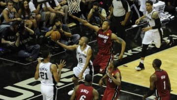 Jun 5, 2014; San Antonio, TX, USA; San Antonio Spurs guard Tony Parker (9) shoots against the Miami Heat in game one of the 2014 NBA Finals at AT&T Center. Mandatory Credit: Brendan Maloney-USA TODAY Sports