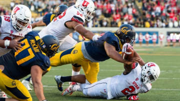 Oct 1, 2016; Berkeley, CA, USA; California Golden Bears defensive tackle James Looney (9) tackles Utah Utes running back Zack Moss (2) in the last play of the game in the fourth quarter at Memorial Stadium. Cal won 28-23. Mandatory Credit: John Hefti-USA TODAY Sports