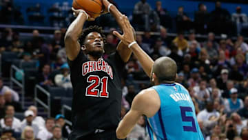Dec 23, 2016; Charlotte, NC, USA; Chicago Bulls forward Jimmy Butler (21) shoots the ball over Charlotte Hornets guard Nicolas Batum (5) in the second half at Spectrum Center. The Hornets defeated the Bulls 103-91. Mandatory Credit: Jeremy Brevard-USA TODAY Sports