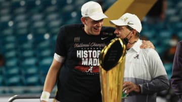 MIAMI GARDENS, FLORIDA - JANUARY 11: Mac Jones #10 of the Alabama Crimson Tide celebrates with head coach Nick Saban after defeating the Ohio State Buckeyes 52-24 in the College Football Playoff National Championship game at Hard Rock Stadium on January 11, 2021 in Miami Gardens, Florida. (Photo by Mike Ehrmann/Getty Images)