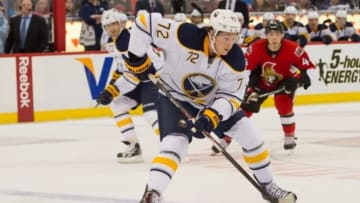 Dec 12, 2013; Ottawa, Ontario, CAN; Buffalo Sabres center Luke Adam (72) controls the puck in the first period against the Ottawa Senators at the Canadian Tire Centre. Mandatory Credit: Marc DesRosiers-USA TODAY Sports
