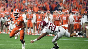 Jan 11, 2016; Glendale, AZ, USA; Clemson Tigers quarterback Deshaun Watson (4) scrambles away from Alabama Crimson Tide linebacker Ryan Anderson (22) during the fourth quarterin the 2016 CFP National Championship at University of Phoenix Stadium. Mandatory Credit: Kirby Lee-USA TODAY Sports