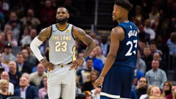 CLEVELAND, OH - FEBRUARY 7: LeBron James #23 of the Cleveland Cavaliers and Jimmy Butler #23 of the Minnesota Timberwolves joke with each other between plays during the first half at Quicken Loans Arena on February 7, 2018 in Cleveland, Ohio. The Cavaliers defeated the Timberwolves 140-138 in overtime. NOTE TO USER: User expressly acknowledges and agrees that, by downloading and or using this photograph, User is consenting to the terms and conditions of the Getty Images License Agreement. (Photo by Jason Miller/Getty Images)