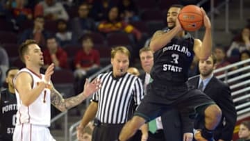 Nov 15, 2014; Los Angeles, CA, USA; Portland State Vikings guard Bryce White (3) attempts to save a ball from going out of bounds as Southern California Trojans guard Katin Reinhardt (1) watches at Galen Center. Portland State defeated USC 76-68. Mandatory Credit: Kirby Lee-USA TODAY Sports