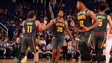 PHOENIX, AZ - NOVEMBER 14: Trae Young #11 and Damian Jones #30 of the Atlanta Hawks high-five during a game against the Phoenix Suns on November 14, 2019 at Talking Stick Resort Arena in Phoenix, Arizona. NOTE TO USER: User expressly acknowledges and agrees that, by downloading and or using this photograph, user is consenting to the terms and conditions of the Getty Images License Agreement. Mandatory Copyright Notice: Copyright 2019 NBAE (Photo by Barry Gossage/NBAE via Getty Images)