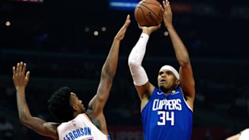 LOS ANGELES, CA - OCTOBER 19: Tobias Harris #34 of the Los Angeles Clippers scores a basket over Terrance Ferguson #23 of the Oklahoma City Thunder during the first half of a basketball game at Staples Center on October 19, 2018 in Los Angeles, California. NOTE TO USER: User expressly acknowledges and agrees that, by downloading and or using this photograph, User is consenting to the terms and conditions of the Getty Images License Agreement. (Photo by Kevork Djansezian/Getty Images)
