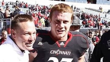 Oct 15, 2011; Cincinnati, OH, USA; Cincinnati Bearcats head coach Butch Jones congratulates linebacker J.K. Schaffer (37) at the end of the game against the Louisville Cardinals at Paul Brown Stadium. The Bearcats defeated the Cardinals, 25-16. Mandatory Credit: Frank Victores-USA TODAY Sports
