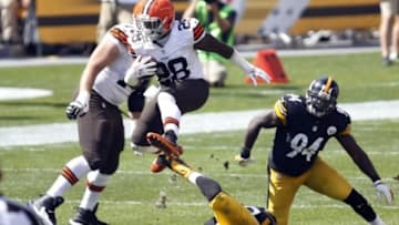 Sep 7, 2014; Pittsburgh, PA, USA; Cleveland Browns running back Terrance West (28) leaps over Pittsburgh Steelers outside linebacker Ryan Shazier (bottom) while carrying the ball during the third quarter at Heinz Field. The Steelers won 30-27. Mandatory Credit: Charles LeClaire-USA TODAY Sports