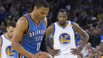 November 3, 2016; Oakland, CA, USA; Oklahoma City Thunder guard Russell Westbrook (0) shoots a technical foul shot as Golden State Warriors forward Kevin Durant (35) looks on during the second quarter at Oracle Arena. Mandatory Credit: Kyle Terada-USA TODAY Sports