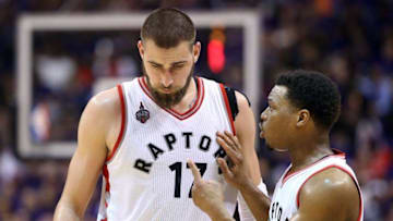 Apr 18, 2016; Toronto, Ontario, CAN; Toronto Raptors point guard Kyle Lowry (7) talks to center Jonas Valanciunas (17) against the Indiana Pacers in game two of the first round of the 2016 NBA Playoffs at Air Canada Centre. The Raptors beat the Pacers 98-87. Mandatory Credit: Tom Szczerbowski-USA TODAY Sports