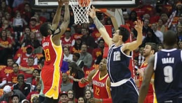 Jan 15, 2015; Houston, TX, USA; Houston Rockets guard James Harden (13) grabs a rebound in front of Oklahoma City Thunder center Steven Adams (12) in the first quarter at Toyota Center. Mandatory Credit: Thomas B. Shea-USA TODAY Sports