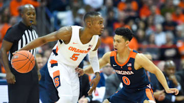 SYRACUSE, NY - NOVEMBER 06: Jalen Carey #5 of the Syracuse Orange controls the ball as Kihei Clark #0 of the Virginia Cavaliers defends during the first half at the Carrier Dome on November 6, 2019 in Syracuse, New York. Virginia defeated Syracuse 48-34. (Photo by Rich Barnes/Getty Images)