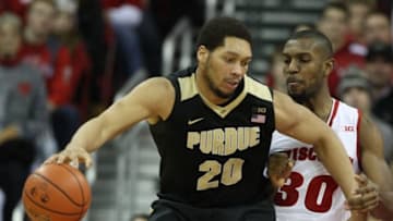 Dec 29, 2015; Madison, WI, USA; Purdue Boilermakers center A.J. Hammons (20) works the ball past Wisconsin Badgers forward Vitto Brown (30) at the Kohl Center. Purdue defeated Wisconsin 61-55. Mandatory Credit: Mary Langenfeld-USA TODAY Sports