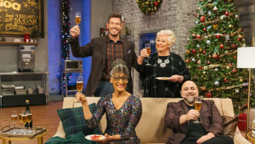 Host Jesse Palmer, Judges Carla Hall, Nancy Fuller and Duff Goldman toast with champagne , as seen on Holiday Baking Championship, Season 8. Photo provided Food Network