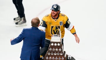 Jun 13, 2023; Las Vegas, Nevada, USA; Vegas Golden Knights forward Jonathan Marchessault (81) shakes hands with Gary Bettman Commissioner of the NHL prior to receiving the Conn Smythe trophy for Most Valuable Player after defeating the Florida Panthers in game five of the 2023 Stanley Cup Final at T-Mobile Arena. Mandatory Credit: Lucas Peltier-USA TODAY Sports