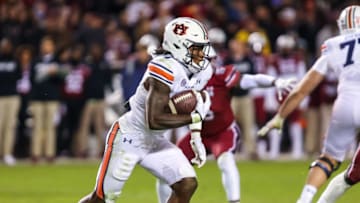 Nov 20, 2021; Columbia, South Carolina, USA; Auburn Tigers running back Tank Bigsby (4) rushes against the South Carolina Gamecocks in the third quarter at Williams-Brice Stadium. Mandatory Credit: Jeff Blake-USA TODAY Sports
