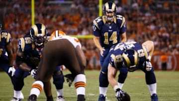 Aug 23, 2014; Cleveland, OH, USA; St. Louis Rams center Scott Wells (63) gets set to snap to quarterback Shaun Hill (14) against the Cleveland Browns at FirstEnergy Stadium. Mandatory Credit: Rick Osentoski-USA TODAY Sports
