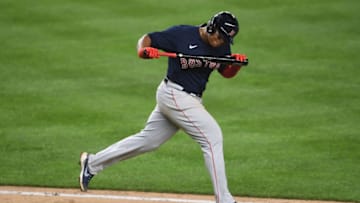 NEW YORK, NEW YORK - AUGUST 14: Rafael Devers #11 of the Boston Red Sox reacts after hitting a fly ball during the sixth inning against the New York Yankees at Yankee Stadium on August 14, 2020 in the Bronx borough of New York City. (Photo by Sarah Stier/Getty Images)