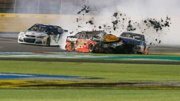 May 21, 2016; Concord, NC, USA; Sprint Cup Series driver Kevin Harvick (4) gets past the collision between Tony Stewart (14) and Kasey Kahne (5) during the Sprint All-Star Race at Charlotte Motor Speedway. Mandatory Credit: Jim Dedmon-USA TODAY Sports