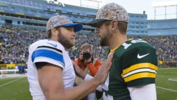 Nov 15, 2015; Green Bay, WI, USA; Detroit Lions quarterback Matthew Stafford (9) greets Green Bay Packers quarterback Aaron Rodgers (12) following the game at Lambeau Field. Detroit won 18-16. Mandatory Credit: Jeff Hanisch-USA TODAY Sports
