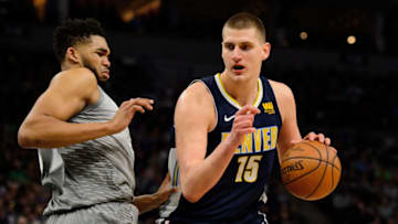 MINNEAPOLIS, MN - APRIL 11: Karl-Anthony Towns #32 of the Minnesota Timberwolves defends against Nikola Jokic #15 of the Denver Nuggets during the game on April 11, 2018 at the Target Center in Minneapolis, Minnesota. The Timberwolves defeated the Nuggets 112-106. NOTE TO USER: User expressly acknowledges and agrees that, by downloading and or using this Photograph, user is consenting to the terms and conditions of the Getty Images License Agreement. (Photo by Hannah Foslien/Getty Images)