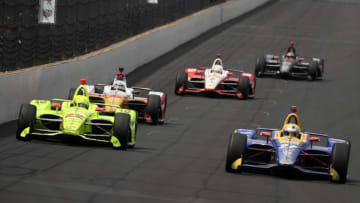 INDIANAPOLIS, INDIANA - MAY 26: Simon Pagenaud of France, driver of the #22 Menards Team Penske Chevrolet races Alexander Rossi of the United States, driver of the #27 NAPA Auto Parts Andretti Autosport Honda (Photo by Chris Graythen/Getty Images)