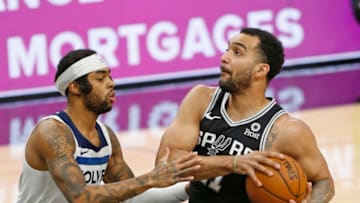 SAN ANTONIO, TX - FEBRUARY 03: Trey Lyles #41 of the San Antonio Spurs drives on D'Angelo Russell #0 of the Minnesota Timberwolves during the first half at AT&T Center on February 3, 2021 in San Antonio, Texas. NOTE TO USER: User expressly acknowledges and agrees that , by downloading and or using this photograph, User is consenting to the terms and conditions of the Getty Images License Agreement. (Photo by Ronald Cortes/Getty Images)
