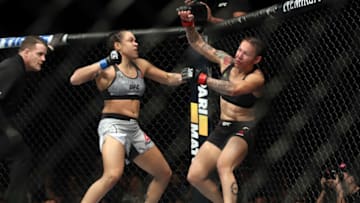 INGLEWOOD, CA - DECEMBER 29: (L-R) Amanda Nunes of Brazil punches Cris Cyborg of Brazil in their women's featherweight bout during the UFC 232 event inside The Forum on December 29, 2018 in Inglewood, California. (Photo by Christian Petersen/Zuffa LLC/Zuffa LLC via Getty Images)