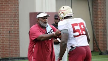Defensive line coach Odell Haggins and defensive end Dennis Briggs at FSU football practice on Aug. 5, 2019.Img 3139