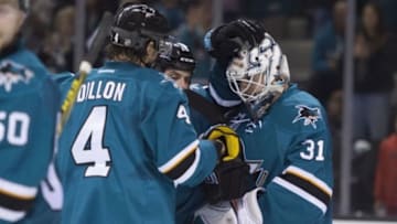 January 9, 2016; San Jose, CA, USA; San Jose Sharks goalie Martin Jones (31) is congratulated by defenseman Brenden Dillon (4) after the game against the Toronto Maple Leafs at SAP Center at San Jose. The Sharks defeated the Maple Leafs 7-0. Mandatory Credit: Kyle Terada-USA TODAY Sports