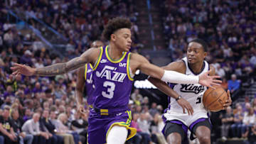 Oct 25, 2023; Salt Lake City, Utah, USA; Utah Jazz guard Keyonte George (3) tries to keep Sacramento Kings guard De'Aaron Fox (5) from getting to the basket during the second quarter at Delta Center. Mandatory Credit: Chris Nicoll-USA TODAY Sports