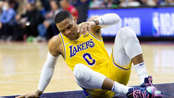 Jan 27, 2022; Philadelphia, Pennsylvania, USA; Los Angeles Lakers guard Russell Westbrook (0) sits on the court after falling during the first quarter against the Philadelphia 76ers at Wells Fargo Center. Mandatory Credit: Bill Streicher-USA TODAY Sports