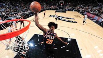 SAN ANTONIO, TX - JANUARY 5: Josh Jackson #20 of the Phoenix Suns rebounds the ball during game against the San Antonio Spurs on January 5, 2018 at the AT&T Center in San Antonio, Texas. NOTE TO USER: User expressly acknowledges and agrees that, by downloading and or using this photograph, user is consenting to the terms and conditions of the Getty Images License Agreement. Mandatory Copyright Notice: Copyright 2018 NBAE (Photos by Mark Sobhani/NBAE via Getty Images)