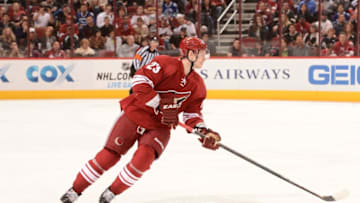 GLENDALE, AZ - MARCH 21: Oliver Ekman-Larrson #23 of the Phoenix Coyotes skates the puck up ice against the Vancouver Canucks at Jobing.com Arena on March 21, 2013 in Glendale, Arizona. (Photo by Norm Hall/NHLI via Getty Images)
