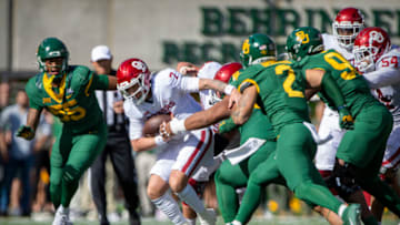 Nov 13, 2021; Waco, Texas, USA; Oklahoma Sooners quarterback Spencer Rattler (7) is tackled by the Baylor Bears defense during the second half at McLane Stadium. Mandatory Credit: Jerome Miron-USA TODAY Sports