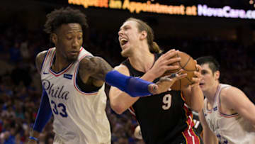 PHILADELPHIA, PA - APRIL 14: Kelly Olynyk #9 of the Miami Heat drives to the basket against Robert Covington #33 of the Philadelphia 76ers during Game One of the first round of the 2018 NBA Playoff at Wells Fargo Center on April 14, 2018 in Philadelphia, Pennsylvania. NOTE TO USER: User expressly acknowledges and agrees that, by downloading and or using this photograph, User is consenting to the terms and conditions of the Getty Images License Agreement. (Photo by Mitchell Leff/Getty Images) *** Local Caption *** Kelly Olynyk;Robert Covington
