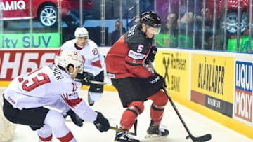 KOSICE, SLOVAKIA - MAY 23: Philipp Kurashev #23 of Switzerland tackles Philippe Myers #5 of Canada during the 2019 IIHF Ice Hockey World Championship Slovakia quarter final game between Canada and Switzerland at Steel Arena on May 23, 2019 in Kosice, Slovakia. (Photo by Lukasz Laskowski/PressFocus/MB Media/Getty Images)
