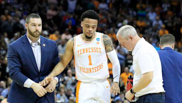 LOUISVILLE, KENTUCKY - MARCH 28: Lamonte Turner #1 of the Tennessee Volunteers is helped off the court after being injured against the Purdue Boilermakers during overtime of the 2019 NCAA Men's Basketball Tournament South Regional at the KFC YUM! Center on March 28, 2019 in Louisville, Kentucky. (Photo by Andy Lyons/Getty Images)