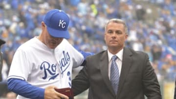 Kansas City Royals manager Ned Yost (3) receives his American League championship ring from general manager Dayton Moore - Mandatory Credit: Denny Medley-USA TODAY Sports